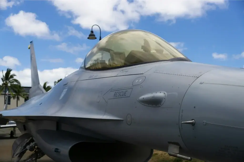 an off centered photo of an F-16 bomber