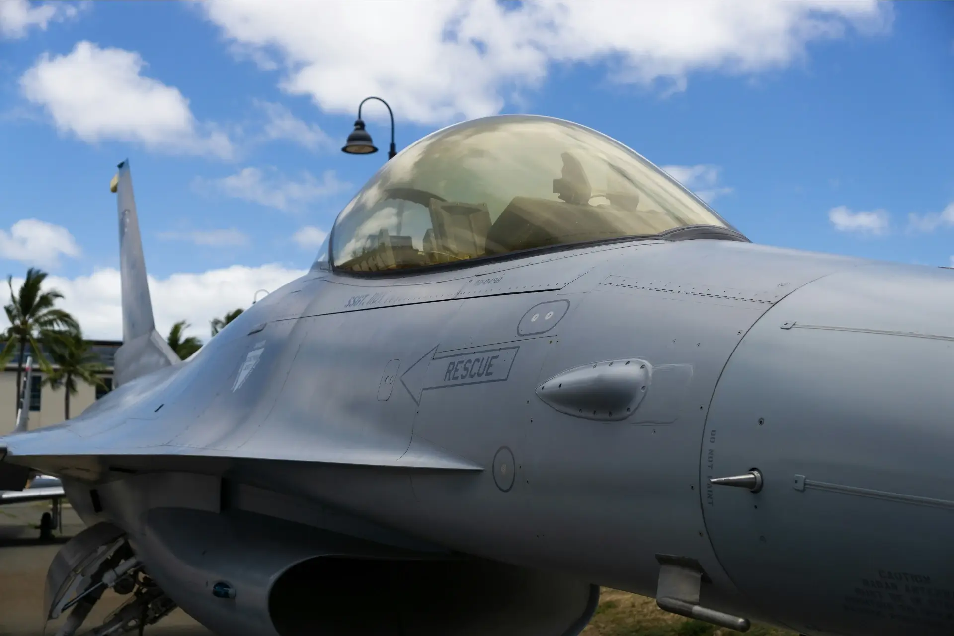 an off centered photo of an F-16 bomber